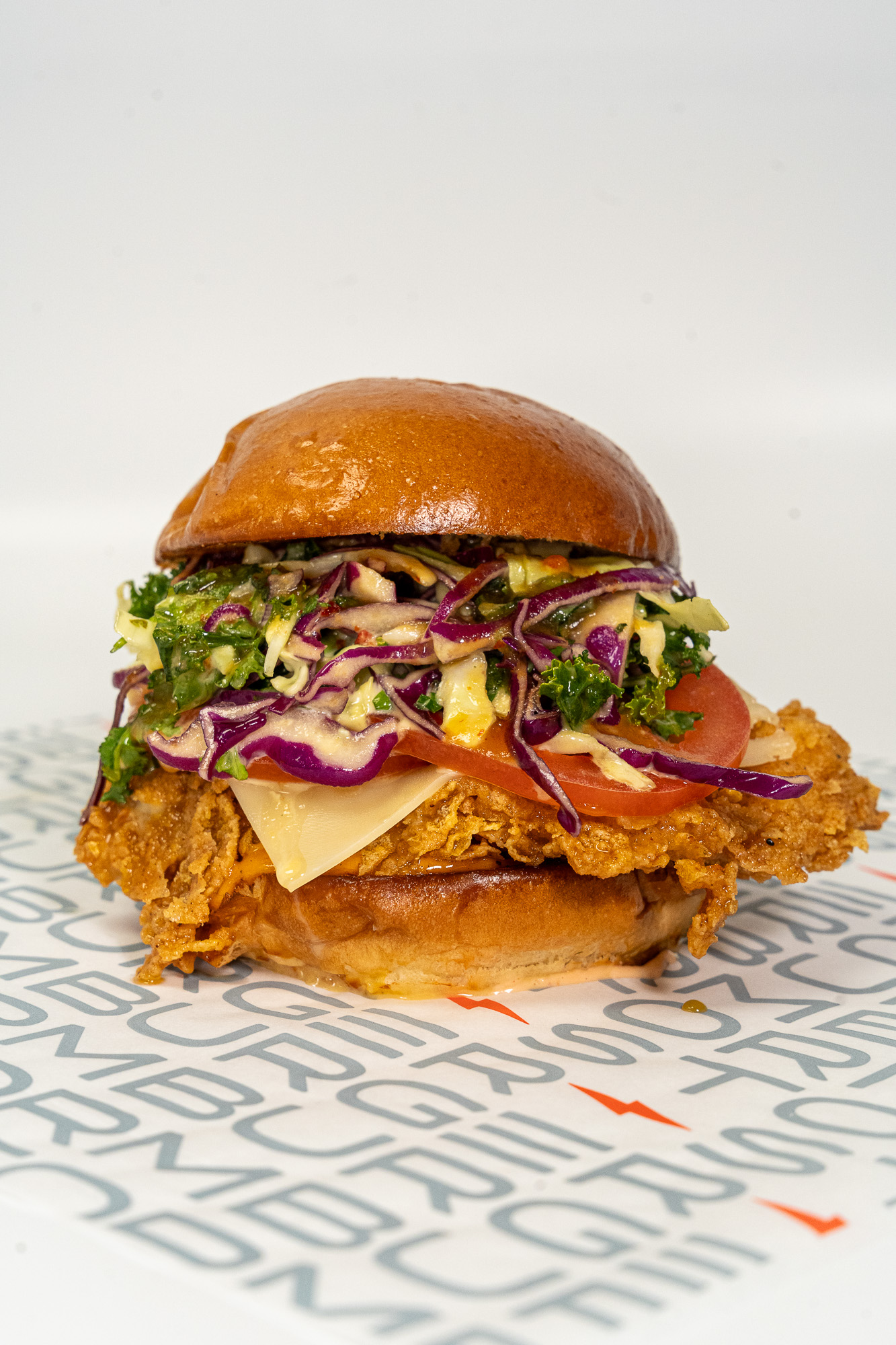 Spicy deluxe chicken sandwich with Thunder sauce and kale slaw at StormBurger in Inglewood and Long Beach